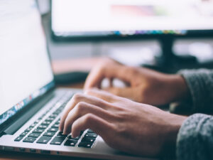 A person working on a laptop.
