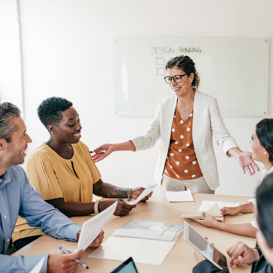 woman giving presentation to team