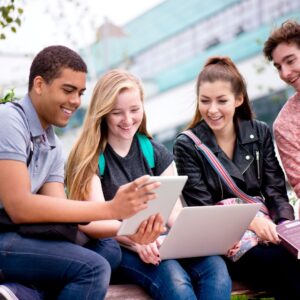 students sitting around with laptops
