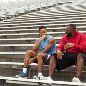 student and mentor on steps