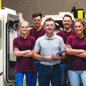 Happy Apprentices in Manufacturing